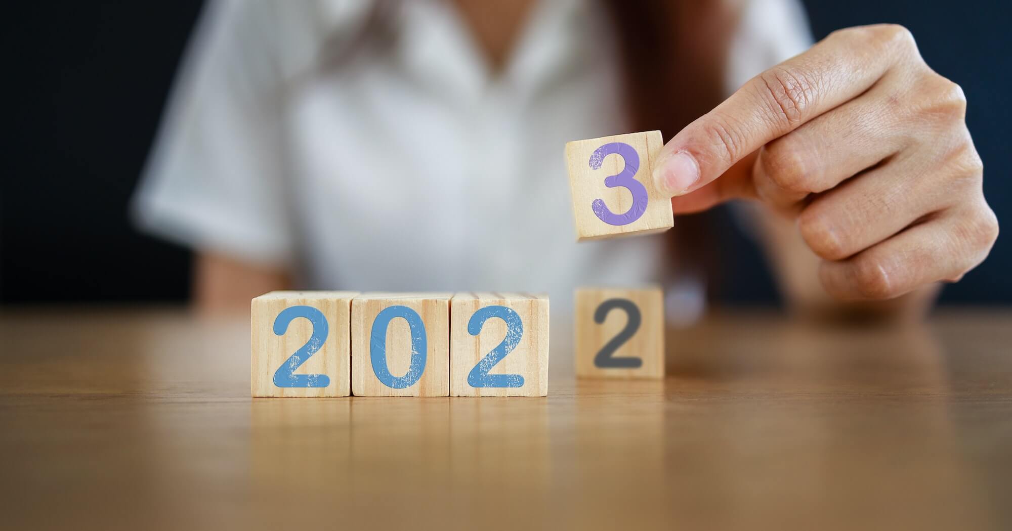 2023 New year concept. From 2022 to 2023 on wooden block. Inspiration to success ideas and goal