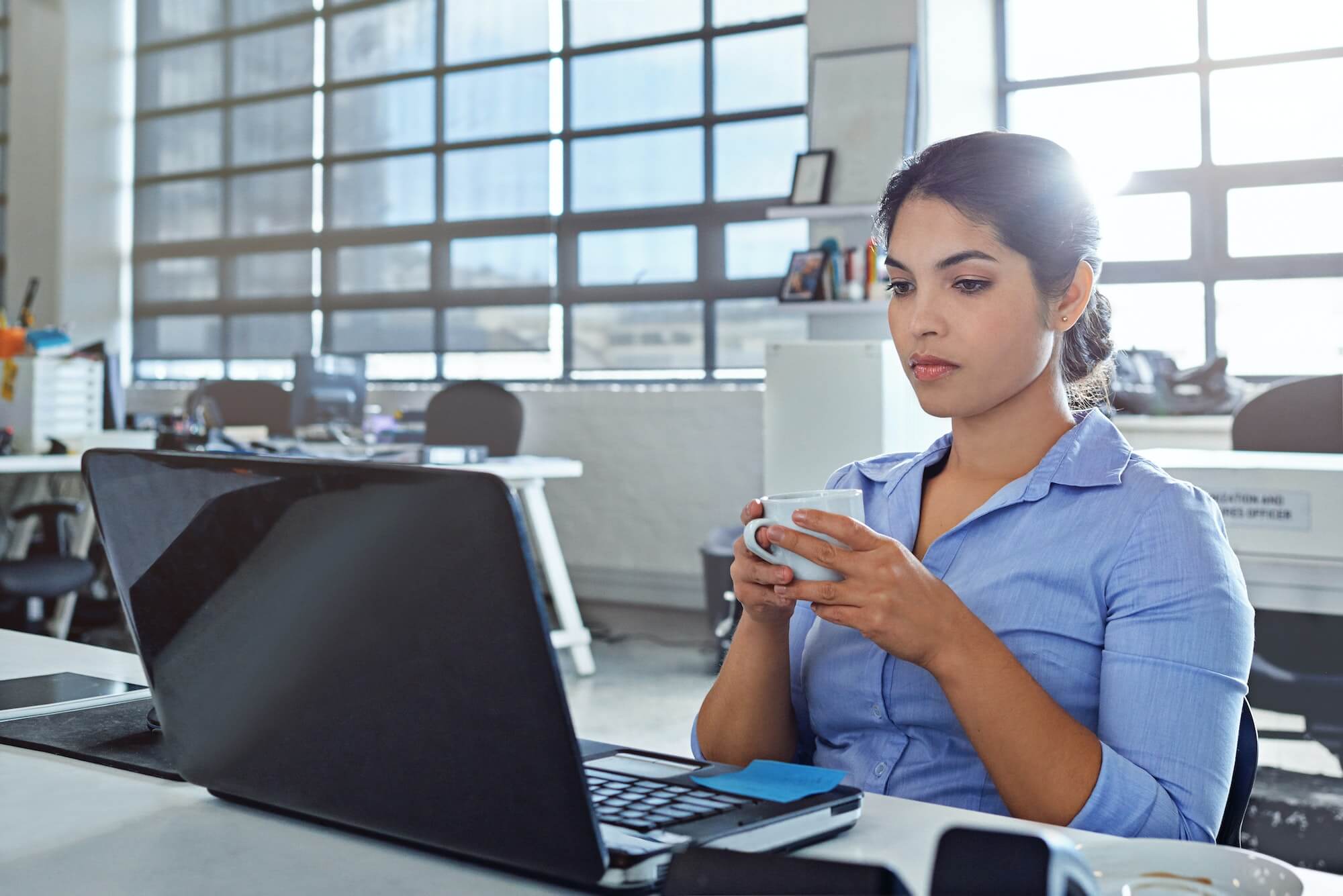 Catching up on emails during her coffee break
